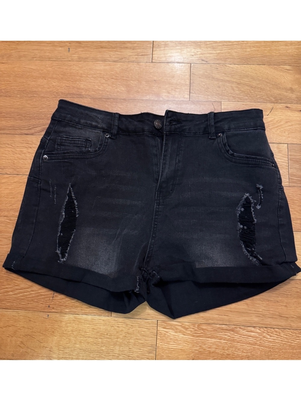 Distressed black high rise rolled hem shorts